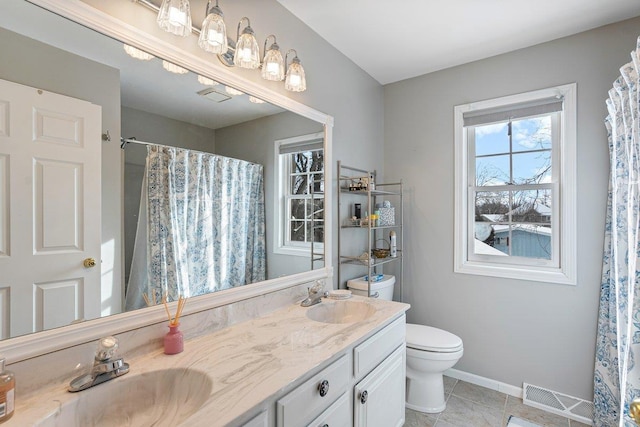 bathroom featuring vanity, tile patterned flooring, a shower with curtain, and toilet