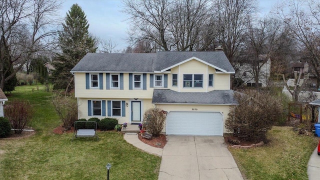 2570 Roanoke Cir, Madison, WI 53719 - view of front facade featuring a garage, concrete driveway, a front yard, and a shingled roof