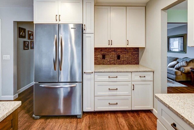 2570 Roanoke Cir, Madison, WI 53719 - kitchen featuring freestanding refrigerator, dark wood-type flooring, decorative backsplash, white cabinetry, and baseboards