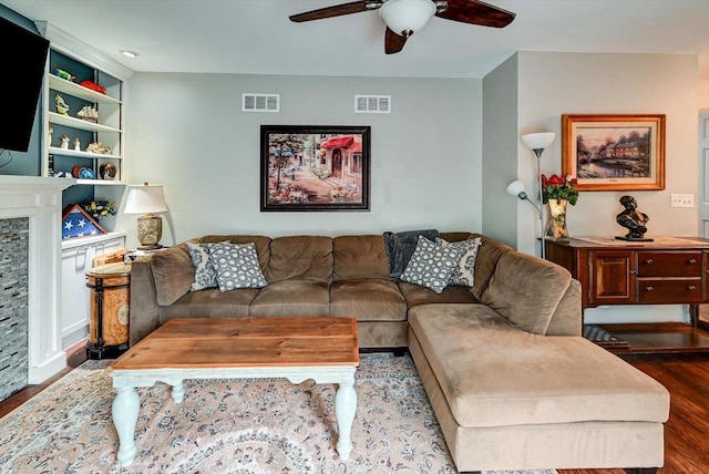 2570 Roanoke Cir, Madison, WI 53719 - living room with wood finished floors, ceiling fan, and a stone fireplace