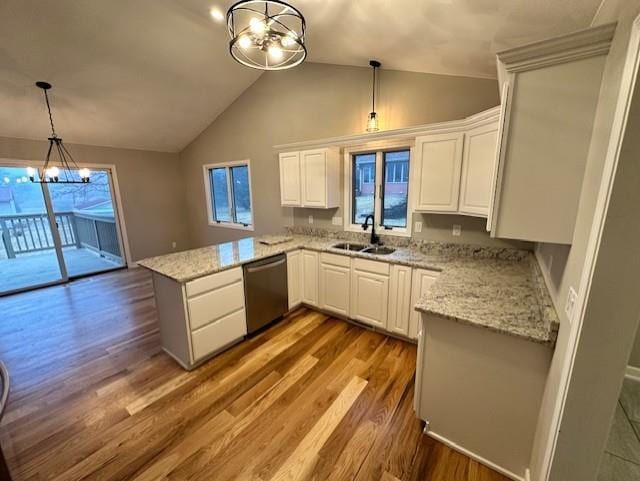 kitchen with sink, dishwasher, white cabinets, kitchen peninsula, and a chandelier