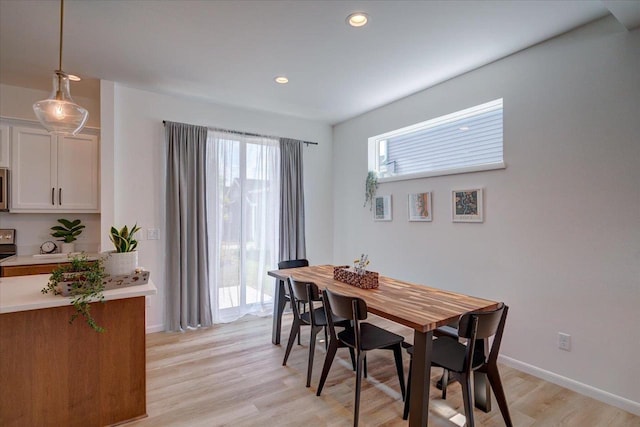 dining area with light wood-type flooring