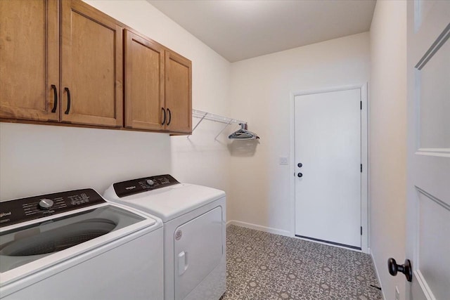 laundry room featuring cabinets and independent washer and dryer