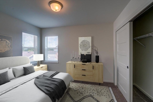 bedroom with a closet and light carpet