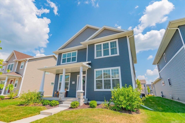 view of front of house featuring a front yard and covered porch