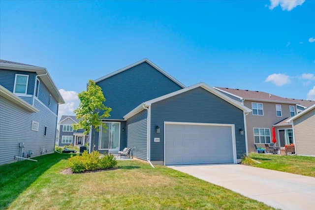 view of front of property with a garage and a front lawn