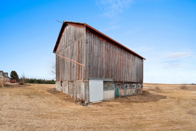 view of outdoor structure with a lawn