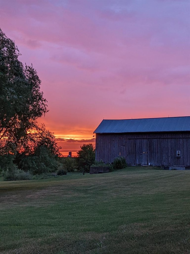 yard at dusk with an outbuilding