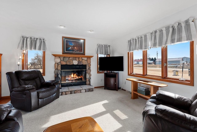 living room featuring carpet flooring and a fireplace