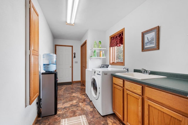 laundry area featuring separate washer and dryer and sink