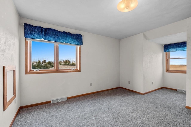 empty room with carpet flooring