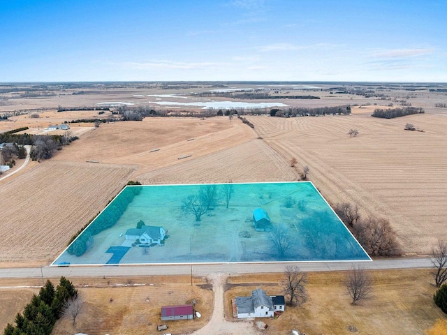 birds eye view of property with a rural view