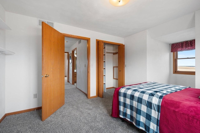 carpeted bedroom featuring a closet