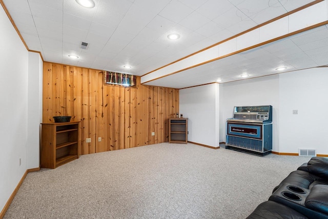 living room with carpet flooring and wooden walls