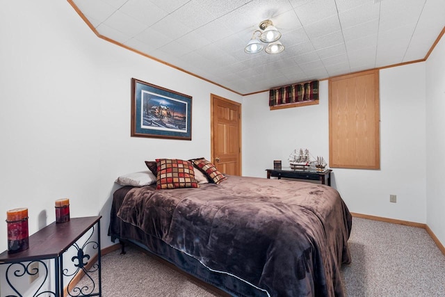 bedroom with crown molding and carpet