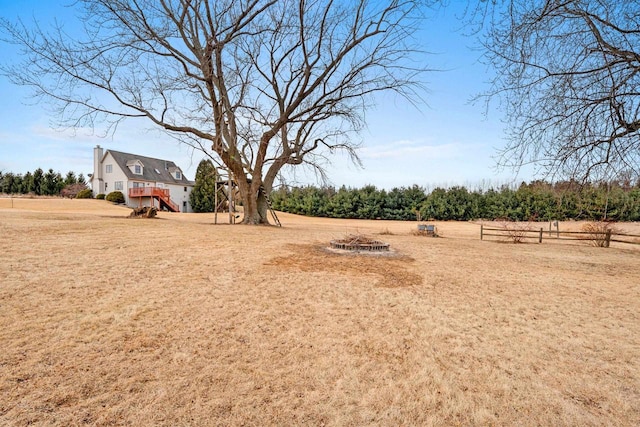 view of yard with a rural view