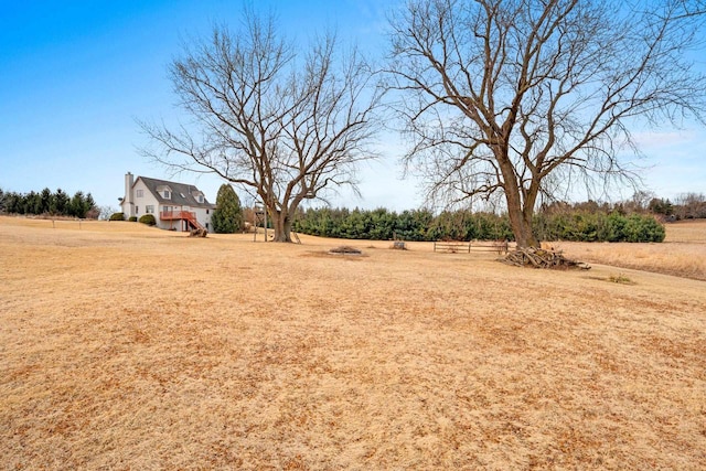 view of yard with a rural view