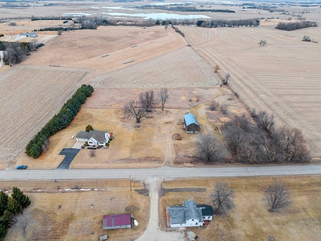 birds eye view of property with a rural view