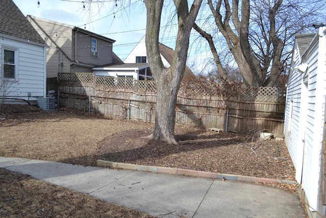 view of yard featuring central AC unit