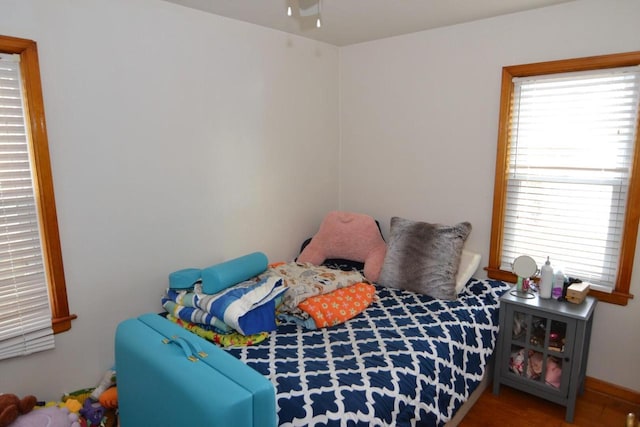 bedroom with wood-type flooring