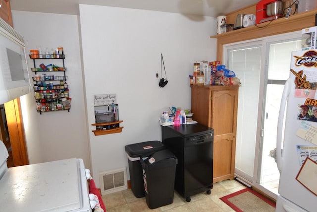 kitchen with refrigerator and white fridge