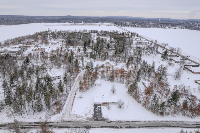 snowy aerial view featuring a mountain view