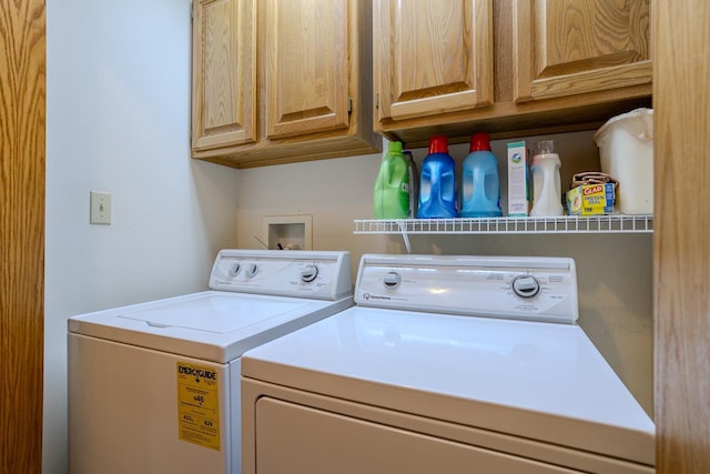 washroom with cabinets and independent washer and dryer