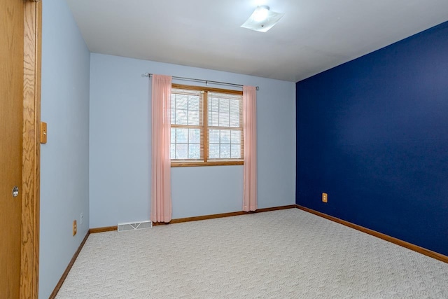 unfurnished room with carpet floors