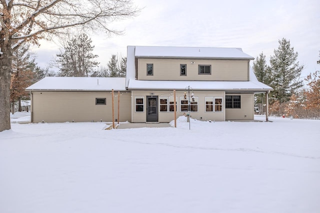 view of snow covered house