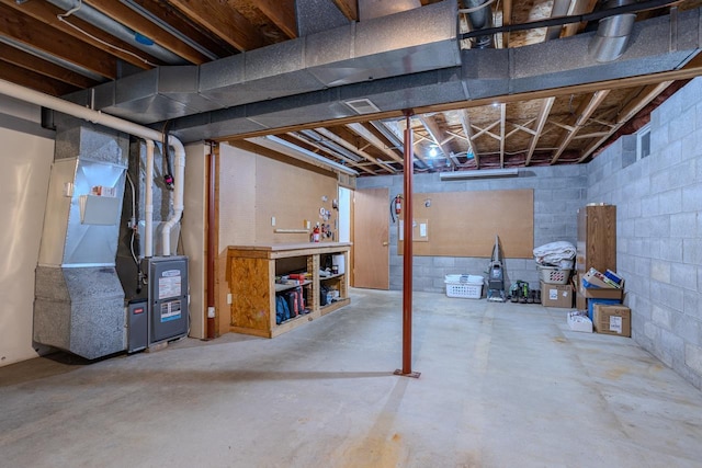 basement featuring heating unit