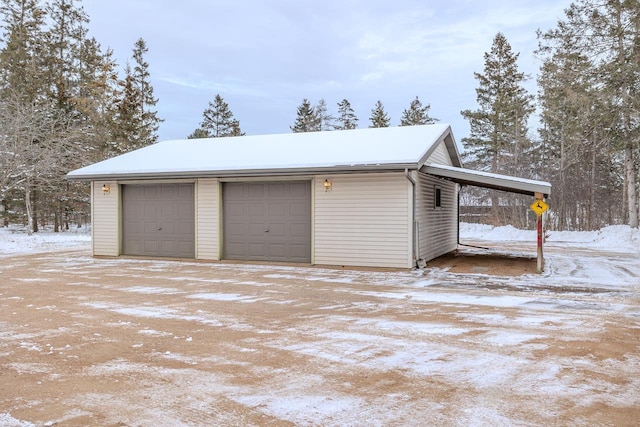 view of snow covered garage