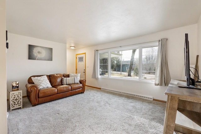 carpeted living room with a baseboard radiator