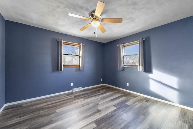 unfurnished room with hardwood / wood-style flooring and ceiling fan