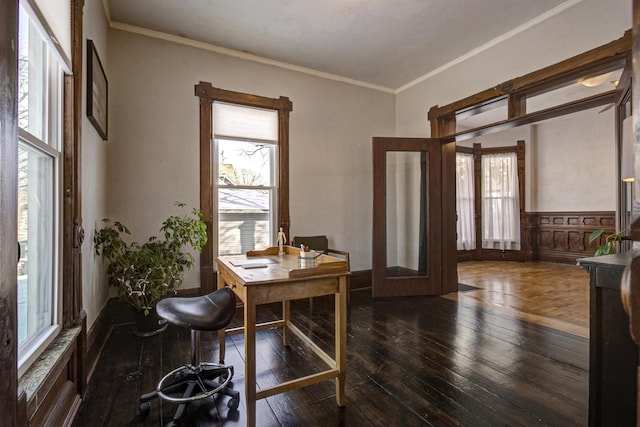 home office featuring ornamental molding, dark wood-type flooring, a wealth of natural light, and french doors