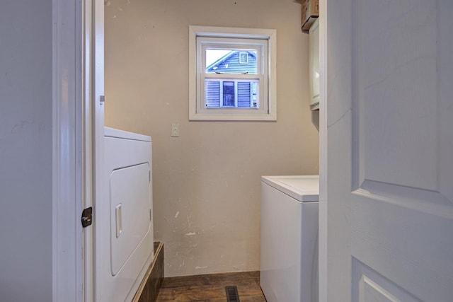 laundry area featuring dark wood-type flooring