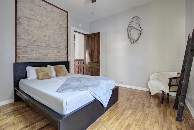 bedroom featuring hardwood / wood-style floors and ceiling fan