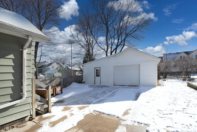 view of snow covered garage