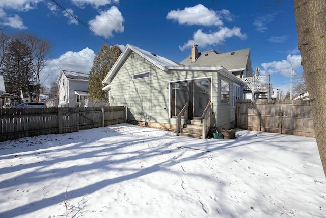 view of snow covered house