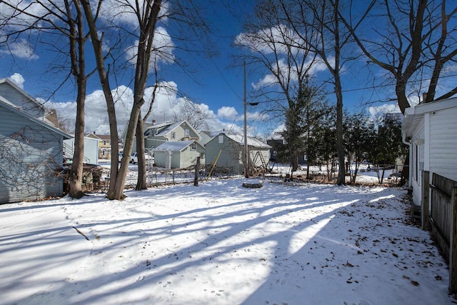 view of yard covered in snow