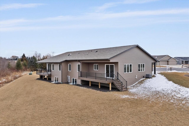 back of house featuring a deck