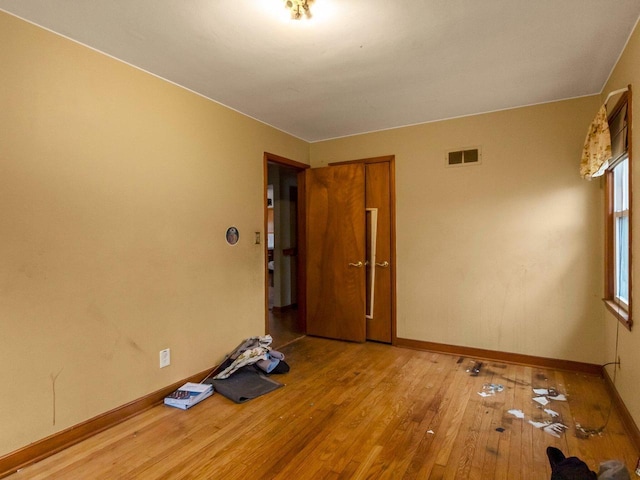 spare room with light hardwood / wood-style floors