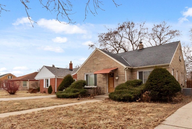 ranch-style house featuring a front lawn