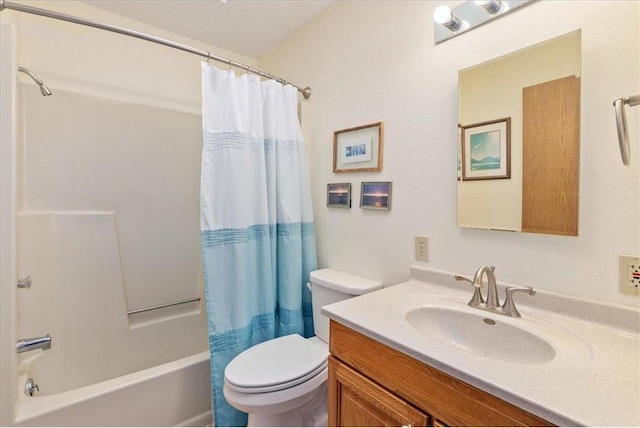 full bathroom featuring vanity, shower / bath combination with curtain, and toilet