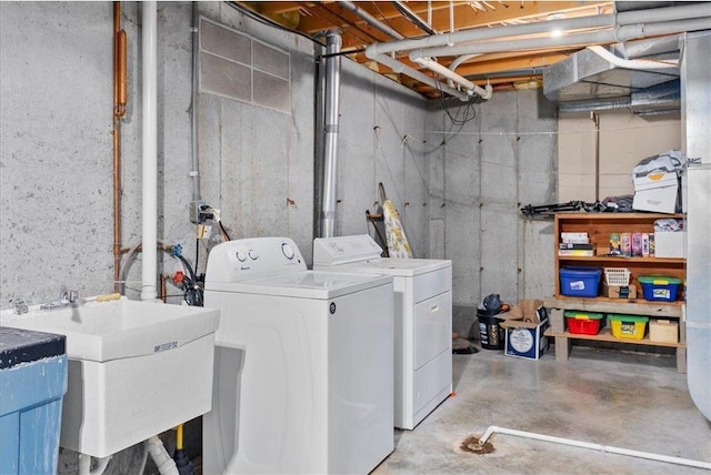 laundry area featuring sink and washer and clothes dryer