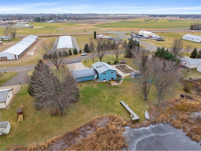 birds eye view of property featuring a rural view