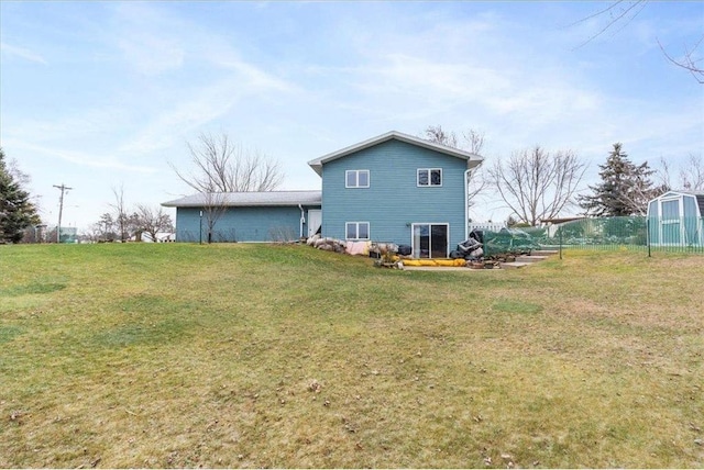 rear view of house with a lawn