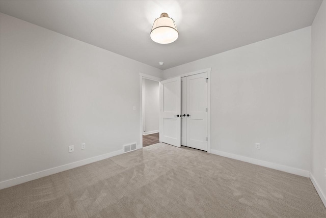 unfurnished room with carpet flooring