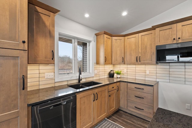 kitchen featuring lofted ceiling, black dishwasher, sink, and decorative backsplash