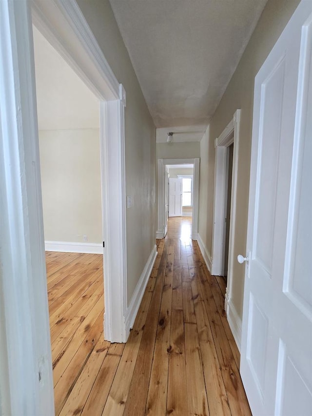 corridor featuring light wood-type flooring