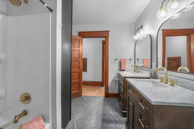 bathroom featuring vanity and shower / tub combination